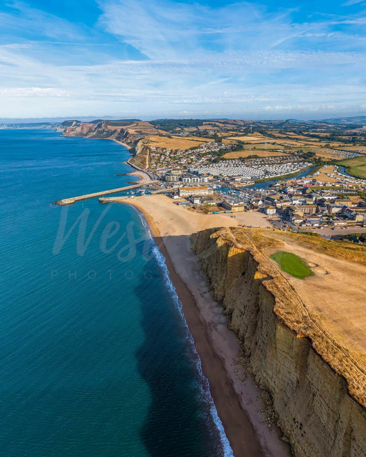 August Morning - aerial view of West Bay, East Cliff and the Jurassic Coast in Dorset