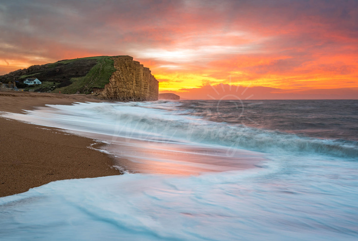 Sunrise over East Beach and East Cliff at West Bay on Dorset's Jurassic Coast