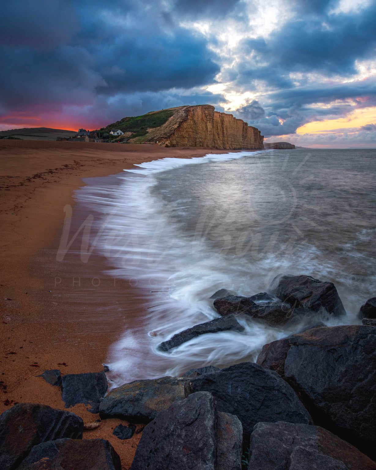 August's End - dramatic sunrise over East Cliff and West Bay beach, Dorset