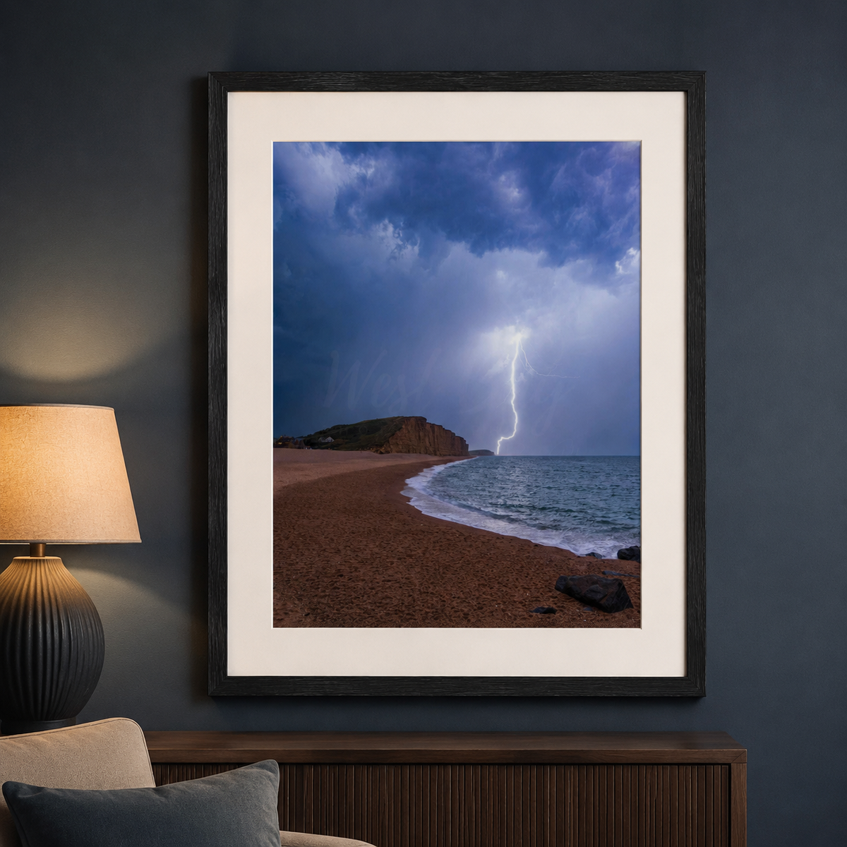 Electric Silence West Bay lightning photograph displayed in a black frame in a contemporary living room