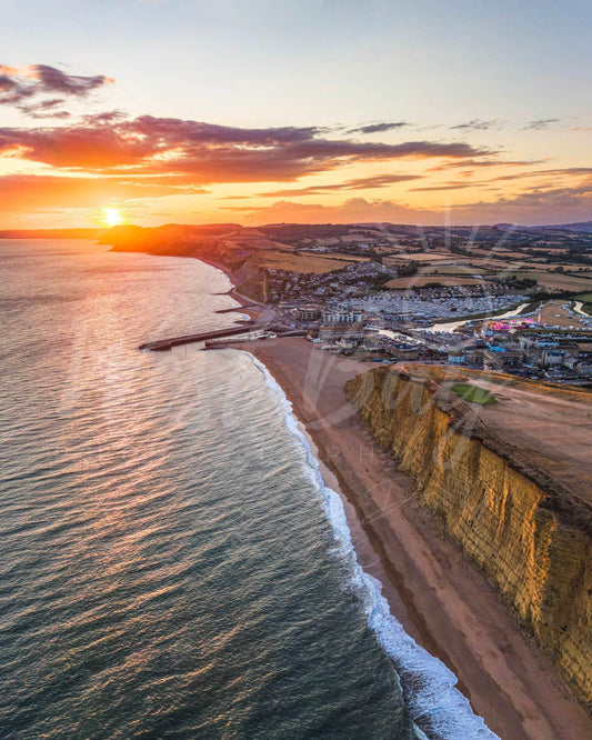 Jurassic Glow - sunset aerial photograph over West Bay and the Jurassic Coast, Dorset
