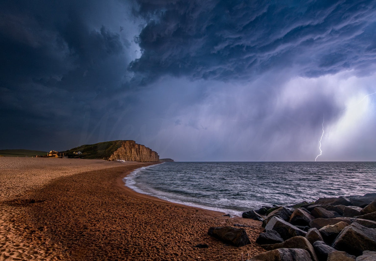 Lightning storm over East Cliff and East Beach at West Bay, Dorset