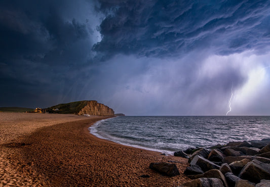 Lightning storm over East Cliff and East Beach at West Bay, Dorset